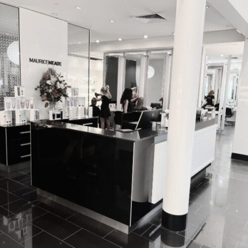Maurice Meade store showcasing luxury hair care products in a chic setting.