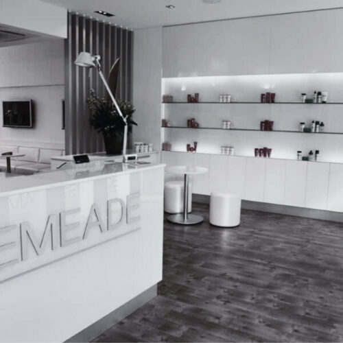 Modern Maurice Meade salon interior with a clean, white reception area.